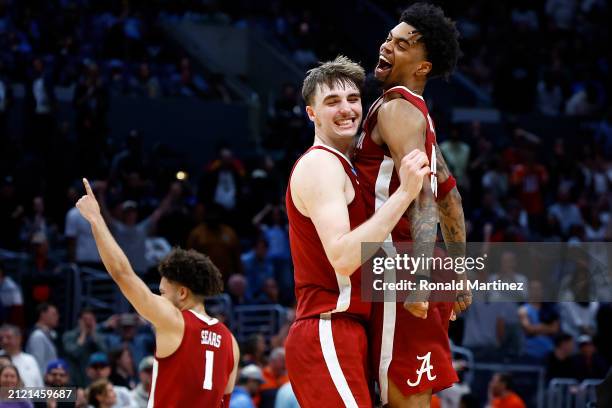 Grant Nelson, Aaron Estrada and Mark Sears the Alabama Crimson Tide celebrate after defeating the North Carolina Tar Heels during the second half in...