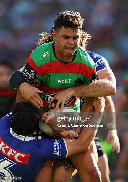 Latrell Mitchell of the Rabbitohs is tackled during the round four NRL match between South Sydney Rabbitohs and Canterbury Bulldogs at Accor Stadium,...