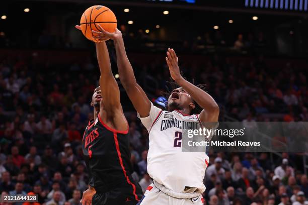 Tristen Newton of the Connecticut Huskies shot is blocked by Lamont Butler of the San Diego State Aztecs during the first half in the Sweet 16 round...