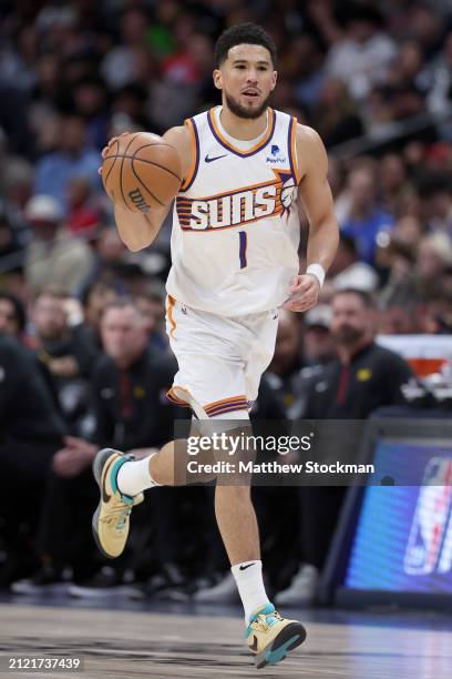 Devin Booker of the Phoenix Suns plays the Denver Nuggets during the first quarter at Ball Arena on March 27, 2024 in Denver, Colorado. NOTE TO USER:...