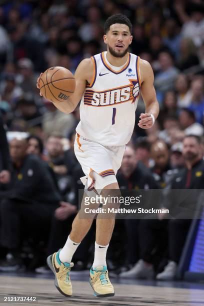 Devin Booker of the Phoenix Suns plays the Denver Nuggets during the first quarter at Ball Arena on March 27, 2024 in Denver, Colorado. NOTE TO USER:...