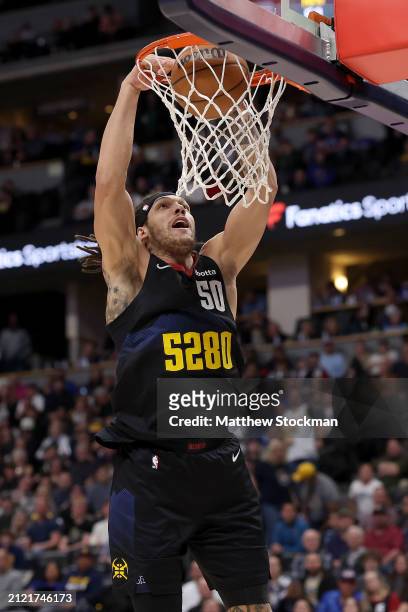 Aaron Gordon of the Denver Nuggets dunks against the Phoenix Suns during the third quarter at Ball Arena on March 27, 2024 in Denver, Colorado. NOTE...