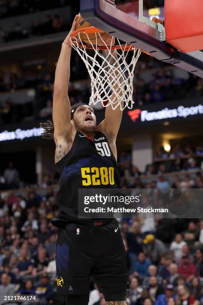Aaron Gordon of the Denver Nuggets dunks against the Phoenix Suns during the third quarter at Ball Arena on March 27, 2024 in Denver, Colorado. NOTE...