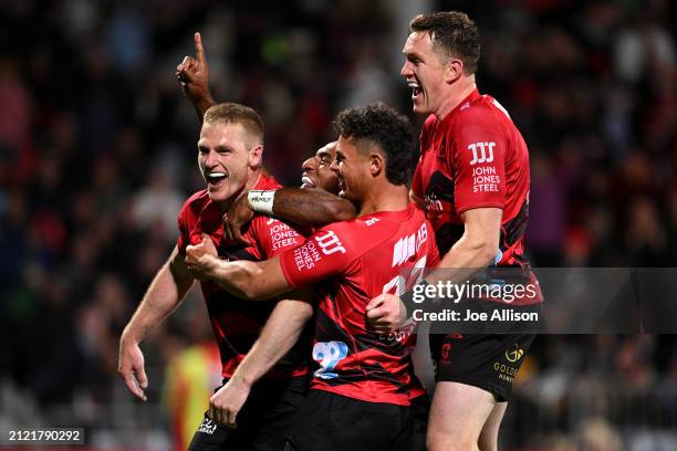 Johnny McNicholl of the Crusaders celebrates after scoring a try during the round six Super Rugby Pacific match between Crusaders and Chiefs at...