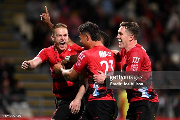 Johnny McNicholl of the Crusaders celebrates after scoring a try during the round six Super Rugby Pacific match between Crusaders and Chiefs at...