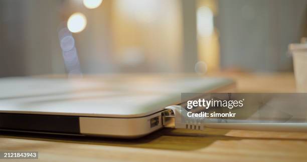 network connection plug connect to laptop - modem imagens e fotografias de stock