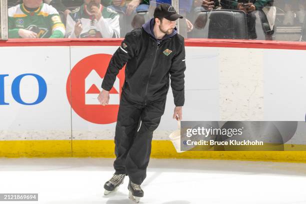 The ice crew inspects the ice during the game between the St. Louis Blues and the Minnesota Wild at the Xcel Energy Center on March 23, 2024 in Saint...