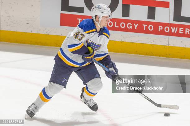 Torey Krug of the St. Louis Blues skates with the puck against the Minnesota Wild during the game at the Xcel Energy Center on March 23, 2024 in...