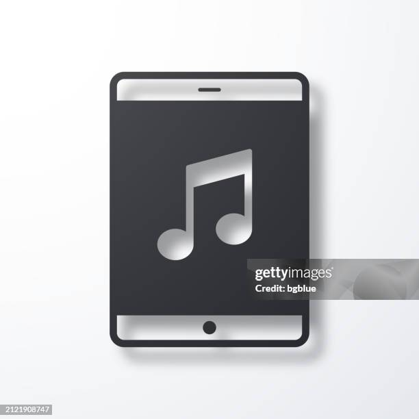 music on tablet pc. icon with shadow on white background - using tablet screen stock illustrations
