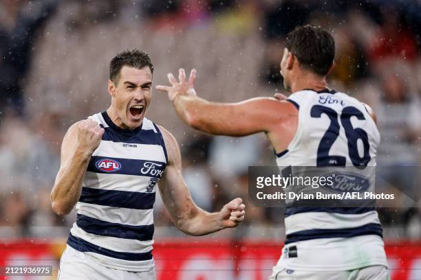 Jeremy Cameron of the Cats celebrates his teammate Tom Hawkins of the Cats who kicked a goal during the 2024 AFL Round 03 match between the Hawthorn...