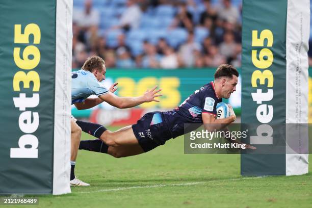 Lachie Anderson of the Rebels scores a try during the round six Super Rugby Pacific match between NSW Waratahs and Melbourne Rebels at Allianz...