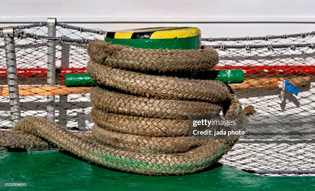 Close up of a green steel mooring bollard