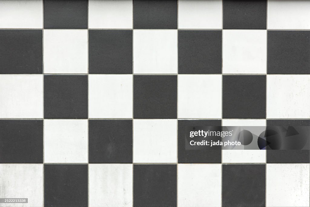 Stone black and white tiles in checkerboard motif