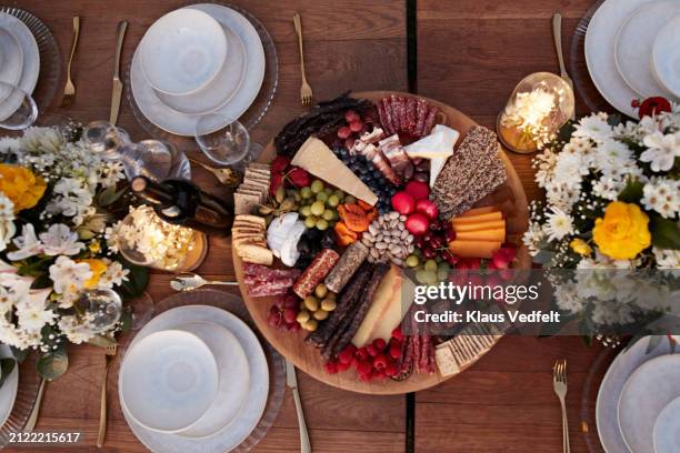 appetizer plate amidst crockery on dining table - dinner party stock pictures, royalty-free photos & images