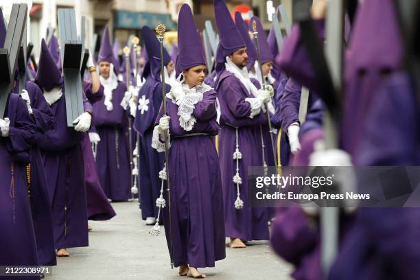 Several people during the procession of Los Salzillos of the Real y Muy Ilustre Cofradia de Nuestro Padre Jesus Nazareno on Good Friday of Holy Week,...