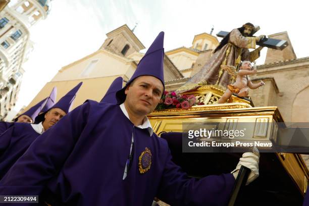 Several people during the procession of Los Salzillos of the Real y Muy Ilustre Cofradia de Nuestro Padre Jesus Nazareno on Good Friday of Holy Week,...
