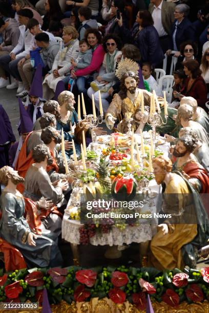 Several people watch a throne of 'The Last Supper', during the procession of Los Salzillos de la Real y Muy Ilustre Cofradia de Nuestro Padre Jesus...