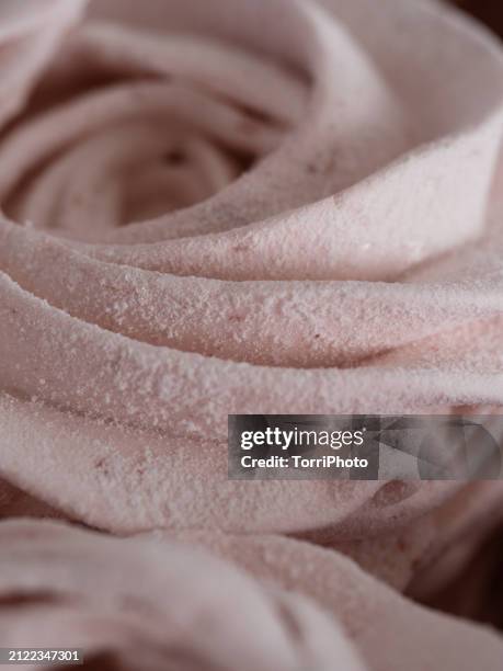 a close-up of tender pink marshmallow rosettes. zefir or zephyr - gelatin powder stock pictures, royalty-free photos & images