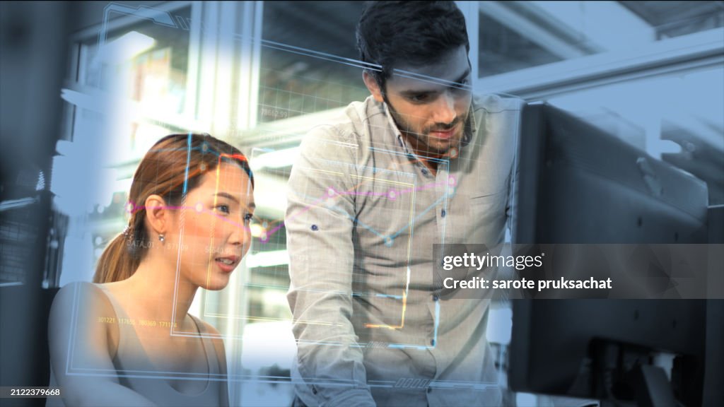 Two Engineers Working on Desktop Computers in Office.