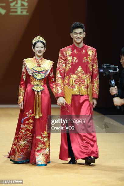 Swimmer Sun Yang and his wife Zhang Doudou walk the runway at TIANXI NEW Collection show on day 5 of the 2024 Autumn/Winter Shanghai Fashion Week at...