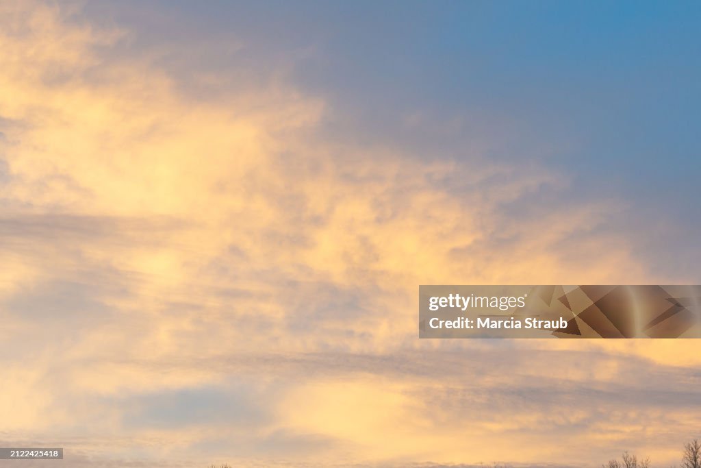 Cirrus Clouds Sweeping Across the Sky at Sunset