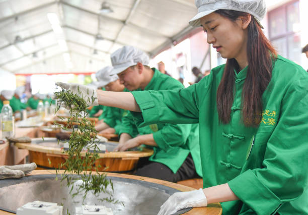 CHN: Tea-leaf Frying Contest Held In Hangzhou