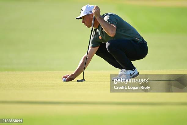 Alex Noren of Sweden lines up a putt on the third green during the second round of the Texas Children's Houston Open at Memorial Park Golf Course on...