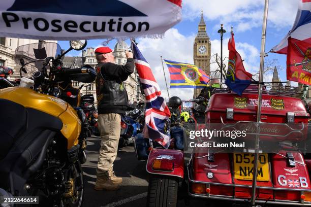 Supporters of the Rolling Thunder group take part in a protest over the prosecution of Northern Ireland veterans, in Parliament Square on March 29,...