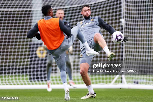 Maximilian Kilman is challenged by Nelson Semedo of Wolverhampton Wanderers during a Wolverhampton Wanderers Training Session at The Sir Jack Hayward...