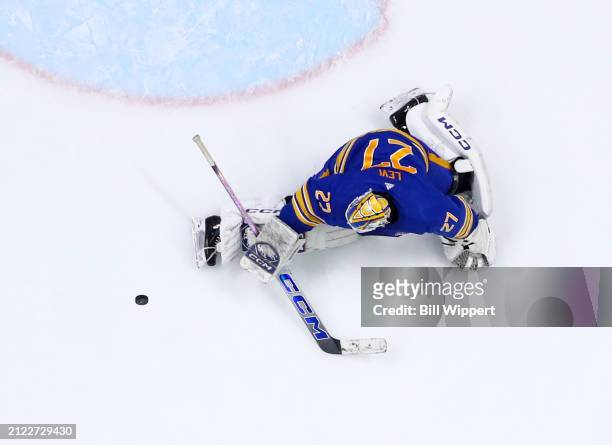 Devon Levi of the Buffalo Sabres makes a save during an NHL game against the Ottawa Senators on March 27, 2024 at KeyBank Center in Buffalo, New York.