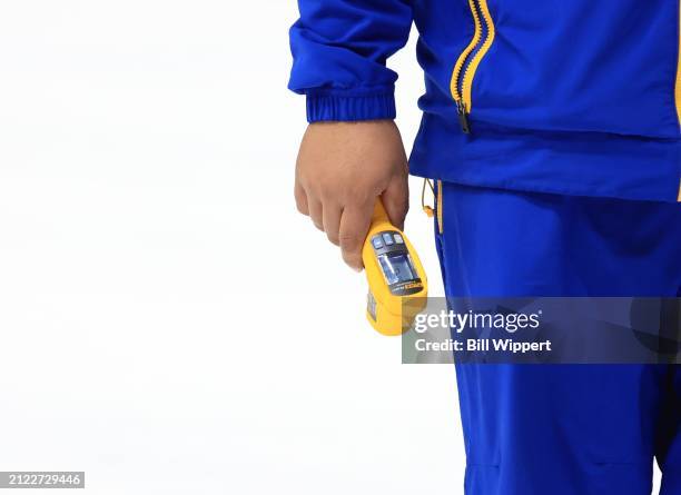 Member of the ice crew takes ice readings during an NHL game between the Buffalo Sabres and the Ottawa Senators on March 27, 2024 at KeyBank Center...