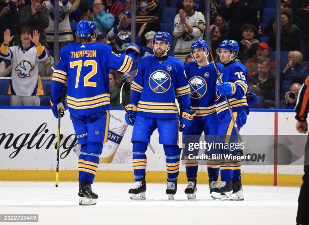 Tage Thompson, Alex Tuch, JJ Peterka and Connor Clifton of the Buffalo Sabres celebrate a goal against the Ottawa Senators during an NHL game on...