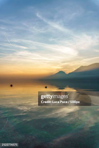 scenic view of sea against sky during sunset,assenza,verona,italy - assenza stock pictures, royalty-free photos & images