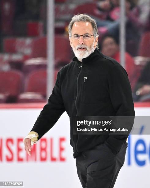 Head coach of the Philadelphia Flyers John Tortorella walks across the ice at the end of the second period against the Montreal Canadiens at the Bell...