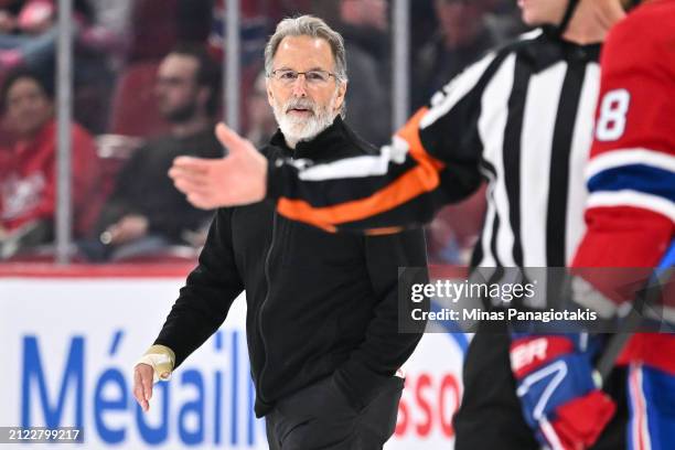 Head coach of the Philadelphia Flyers John Tortorella walks across the ice at the end of the second period against the Montreal Canadiens at the Bell...