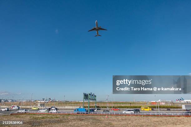 the airplane flying over tokyo of japan - haneda stock pictures, royalty-free photos & images