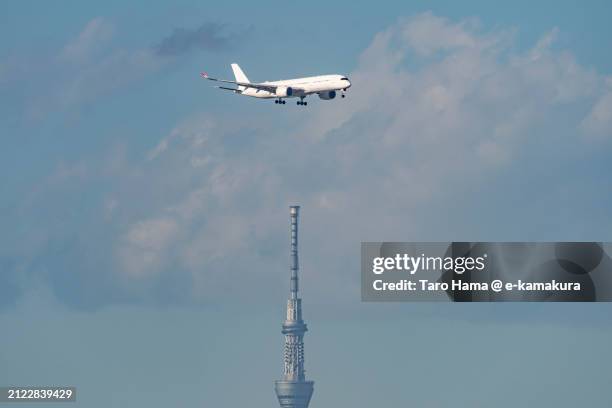 the airplane flying over tokyo of japan - haneda stock pictures, royalty-free photos & images
