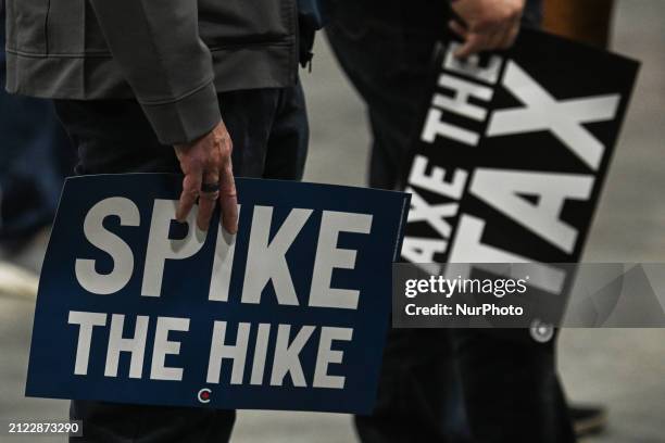 Supporters of Pierre Poilievre, the leader of Canada's Conservative Party, seen during a 'Spike the Hike - Axe the Tax' rally in Edmonton, on March...