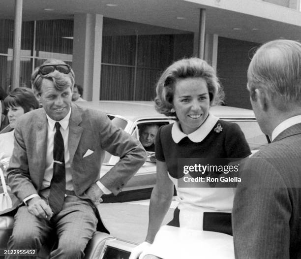 Married American couple politician and US Senator Robert F Kennedy and socialite Ethel Kennedy sit in a convertible as they take with supporters...