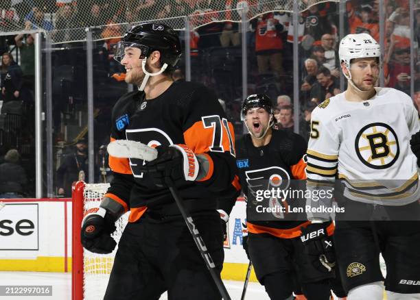 Tyson Foerster of the Philadelphia Flyers reacts with teammate Ryan Poehling following his third period game winning goal against Brandon Carlo of...