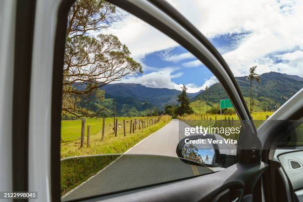 close up view of green mountains at cocora valley with empty car door open - freizeitaktivität im freien stock-fotos und bilder