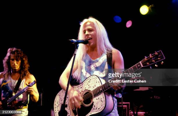 American musicians Brett Garsed and Gunnar Nelson, of the American rock band Nelson, perform on stage during a concert during the 1991 After the Rain...