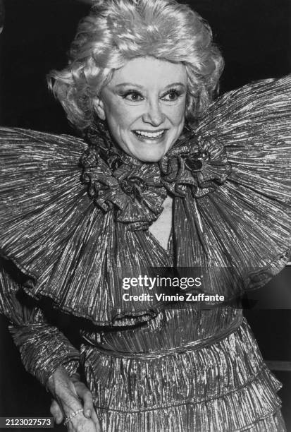 American comedian and actress Phyllis Diller, wearing a ruffled outfit with high shoulders, attends the 32nd Annual Thalians Ball, held at the...