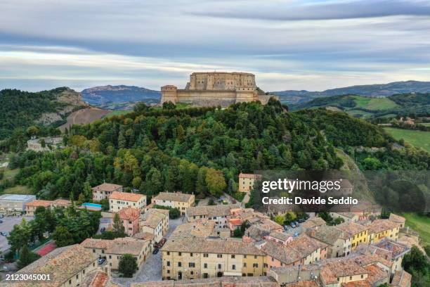 aerial view of the fortress of san leo overlooking the of san leo - emilia romagna stock pictures, royalty-free photos & images
