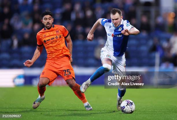 Ryan Hedges of Blackburn Rovers is challenged by Massimo Luongo of Ipswich Town during the Sky Bet Championship match between Blackburn Rovers and...