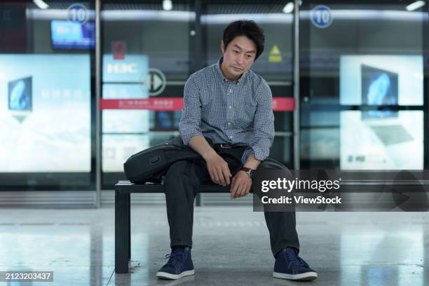 subway platform fatigue middle-aged men - midlife crisis stock pictures, royalty-free photos & images