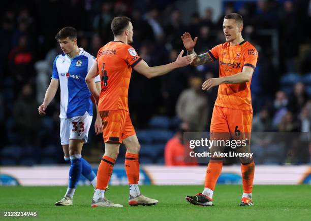 George Edmundson and Luke Woolfenden of Ipswich Town celebrate after the team's victory during the Sky Bet Championship match between Blackburn...