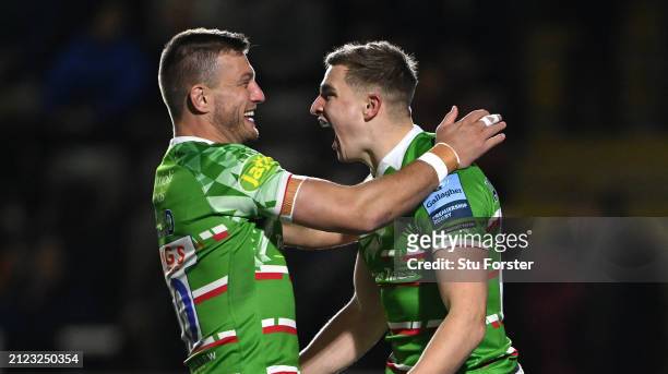 Tigers scrum half Jack van Poortvliet is congratulated by Handre Pollard after scoring the opening try during the Gallagher Premiership Rugby match...
