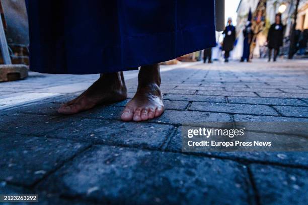 Barefoot person during the procession of the Christ of Medinaceli, on 29 March, 2024 in Madrid, Spain. This Good Friday procession is organized by...