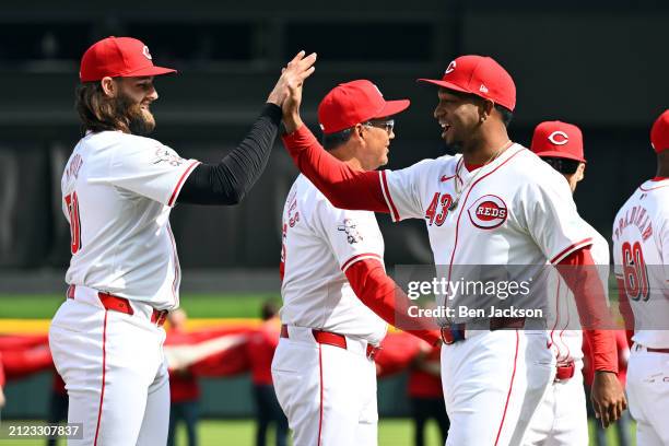 Alexis Diaz of the Cincinnati Reds high fives teammate Tejay Antone of the Cincinnati Reds after being introduced on Opening Day prior to a game...